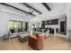 Spacious living room with a modern fireplace and a walkout to the back yard at 10119 Laurier Ln, Huntersville, NC 28078