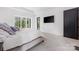 Relaxing main bedroom featuring plush carpet and access to the backyard at 10119 Laurier Ln, Huntersville, NC 28078