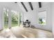 Bright office space with backyard view and black desk at 10119 Laurier Ln, Huntersville, NC 28078