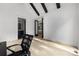 Bright office space with beamed ceiling and access to bathroom and bedroom at 10119 Laurier Ln, Huntersville, NC 28078