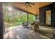 Inviting outdoor living space with comfortable seating and serene backyard views at 10119 Laurier Ln, Huntersville, NC 28078
