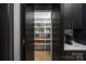 Walk-in pantry with custom shelving and ample storage space at 10119 Laurier Ln, Huntersville, NC 28078