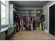 Large walk-in closet with ample hanging space and built-in desk at 10119 Laurier Ln, Huntersville, NC 28078
