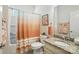 Bathroom featuring granite countertop, bathtub/shower combo, and neutral decor at 10120 Berkeley Castle Dr, Charlotte, NC 28273