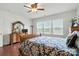 Relaxing bedroom with hardwood floors, multiple windows for natural light, and comfortable furnishings at 10120 Berkeley Castle Dr, Charlotte, NC 28273