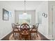 Charming dining area with natural light, hardwood floors, and a view of the outdoors at 10120 Berkeley Castle Dr, Charlotte, NC 28273