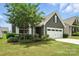 Charming home featuring a two-car garage and beautifully landscaped front yard at 10120 Berkeley Castle Dr, Charlotte, NC 28273