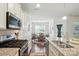 Modern kitchen featuring stainless steel appliances, granite counters, and an adjacent dining area at 10120 Berkeley Castle Dr, Charlotte, NC 28273