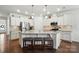 Spacious kitchen with a large island, granite countertops, and stainless steel appliances at 10120 Berkeley Castle Dr, Charlotte, NC 28273