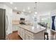 Bright, open kitchen with granite countertops, stainless steel appliances, and hardwood flooring throughout at 10120 Berkeley Castle Dr, Charlotte, NC 28273