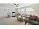 Spacious living room with natural light, neutral décor, and comfortable seating at 10120 Berkeley Castle Dr, Charlotte, NC 28273