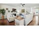 Bright living room featuring a fireplace, hardwood floors, and comfortable seating area at 10120 Berkeley Castle Dr, Charlotte, NC 28273
