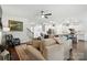 Open-concept living room showcasing hardwood floors and seamless connection to the kitchen at 10120 Berkeley Castle Dr, Charlotte, NC 28273