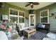 Cozy screened porch with stylish outdoor furniture and decor for relaxing and entertaining guests at 10120 Berkeley Castle Dr, Charlotte, NC 28273