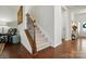 Carpeted staircase with wooden banister and iron spindles leading to the upper level of the home at 10120 Berkeley Castle Dr, Charlotte, NC 28273