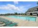 Beautiful community pool with multiple lounge chairs for residents' enjoyment in a serene environment at 10120 Berkeley Castle Dr, Charlotte, NC 28273