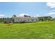Grassy backyard featuring ranch-style house, shed and wooden fence and patio area with landscaping at 1069 Heather Glen Dr, Catawba, NC 28609