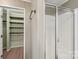 Walk-in closet with built-in shelves and rods at 1069 Heather Glen Dr, Catawba, NC 28609
