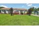 Inviting ranch-style home featuring a pristine lawn, complemented by tasteful landscaping and charming shed at 1069 Heather Glen Dr, Catawba, NC 28609
