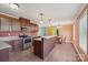 Bright kitchen featuring stainless steel appliances, island with bar seating, and ample cabinet space at 1069 Heather Glen Dr, Catawba, NC 28609