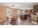 Eat-in kitchen boasting an island with a sink, stylish cabinets, and wood floors at 1069 Heather Glen Dr, Catawba, NC 28609