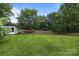 A spacious backyard with shed in the distance at 115 Fox Run Dr, Fort Mill, SC 29715