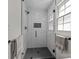 Tiled shower with black framed glass, shower niche, and black shower head and handle at 115 Fox Run Dr, Fort Mill, SC 29715