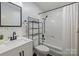 Bathroom featuring patterned wallpaper, vanity with mirror, and shower with tub at 115 Fox Run Dr, Fort Mill, SC 29715