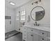 Bathroom with white subway tile shower and vanity featuring marble countertop and modern fixtures at 115 Fox Run Dr, Fort Mill, SC 29715