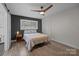 Bedroom features wood-look flooring, ceiling fan, and neutral color palette with natural light at 115 Fox Run Dr, Fort Mill, SC 29715
