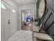 Stylish entryway showcasing modern decor, a round mirror, and open doorway to the living room at 115 Fox Run Dr, Fort Mill, SC 29715