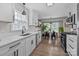 Updated kitchen with stainless steel appliances and adjacent dining area at 115 Fox Run Dr, Fort Mill, SC 29715