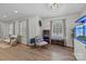 Cozy living room featuring hardwood floors, ample natural light, and stylish decor at 115 Fox Run Dr, Fort Mill, SC 29715