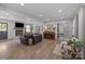 Spacious living room showcasing hardwood floors, fireplace, comfortable seating and an upright piano at 115 Fox Run Dr, Fort Mill, SC 29715