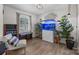 Cozy living room featuring hardwood floors, ample natural light, stylish decor, and a decorative aquarium at 115 Fox Run Dr, Fort Mill, SC 29715