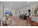 Open concept living room featuring hardwood floors, a decorative fish tank, and comfortable seating at 115 Fox Run Dr, Fort Mill, SC 29715