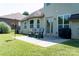 Patio with chairs, lawn, and mature landscaping at 1156 Mckee Farm Ln, Belmont, NC 28012