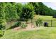 Well-maintained yard with a privacy fence and established garden at 1156 Mckee Farm Ln, Belmont, NC 28012