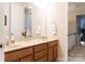 Upstairs bathroom featuring double sinks, vanity with granite countertops and a large mirror at 1156 Mckee Farm Ln, Belmont, NC 28012