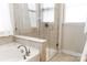 Modern bathroom featuring a glass-enclosed shower and a luxurious soaking tub at 1156 Mckee Farm Ln, Belmont, NC 28012