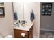 Powder room featuring toilet, sink, vanity with countertop and decorative mirror at 1156 Mckee Farm Ln, Belmont, NC 28012