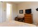 Bedroom featuring a dresser and desk area, as well as an attached bathroom at 1156 Mckee Farm Ln, Belmont, NC 28012