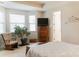 Bright bedroom with a chair, dresser, and a large window providing natural light at 1156 Mckee Farm Ln, Belmont, NC 28012