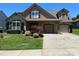Inviting home with a two car garage and well-maintained landscaping at 1156 Mckee Farm Ln, Belmont, NC 28012
