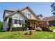 Charming two-story home featuring a well-manicured lawn, flowerbeds, and decorative shutters at 1156 Mckee Farm Ln, Belmont, NC 28012
