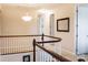 Bright hallway featuring a curved staircase with white spindles and wood handrail at 1156 Mckee Farm Ln, Belmont, NC 28012