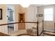 Bright upper hallway with access to a bedroom, featuring natural light and neutral colors at 1156 Mckee Farm Ln, Belmont, NC 28012