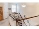 Upper hallway featuring curved staircase, natural light, and neutral colors at 1156 Mckee Farm Ln, Belmont, NC 28012
