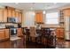 Modern kitchen featuring wood cabinetry and stainless steel appliances at 1156 Mckee Farm Ln, Belmont, NC 28012