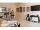 Inviting living room featuring golf decorations, comfortable seating, and a mounted television at 1156 Mckee Farm Ln, Belmont, NC 28012